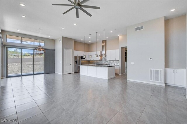 10985 Limeslice Ave Unit 2, Las Vegas, NV 89135 - unfurnished living room featuring light tile patterned floors, ceiling fan, and recessed lighting