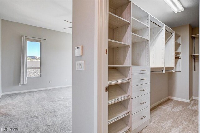 10985 Limeslice Ave Unit 2, Las Vegas, NV 89135 - spacious closet featuring light colored carpet and a ceiling fan