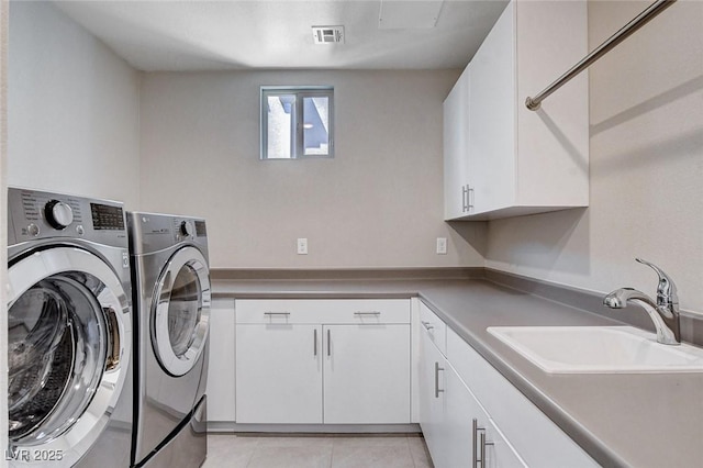 10985 Limeslice Ave Unit 2, Las Vegas, NV 89135 - laundry room featuring cabinet space, washer and clothes dryer, and light tile patterned flooring