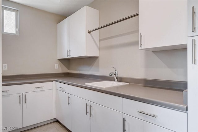 10985 Limeslice Ave Unit 2, Las Vegas, NV 89135 - kitchen featuring white cabinetry, dark countertops, and light tile patterned floors
