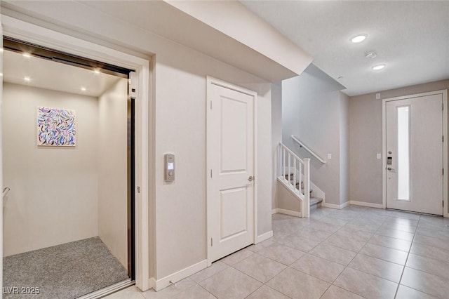 10985 Limeslice Ave Unit 2, Las Vegas, NV 89135 - entrance foyer featuring stairway, recessed lighting, light tile patterned floors, and elevator