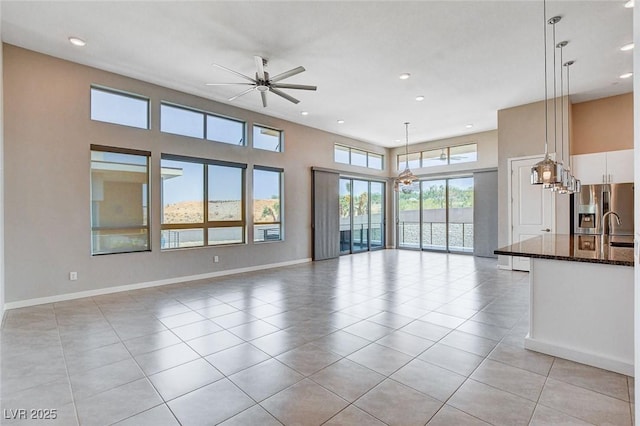 10985 Limeslice Ave Unit 2, Las Vegas, NV 89135 - unfurnished living room featuring a ceiling fan, light tile patterned floors, and recessed lighting