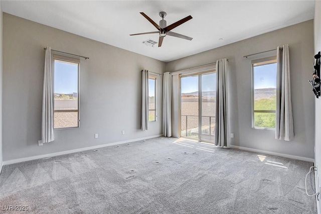 10985 Limeslice Ave Unit 2, Las Vegas, NV 89135 - carpeted empty room with ceiling fan and plenty of natural light