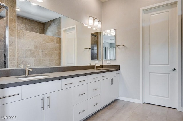 10985 Limeslice Ave Unit 2, Las Vegas, NV 89135 - bathroom featuring double vanity, a tile shower, and tile patterned flooring