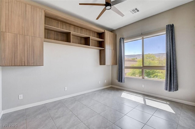 10985 Limeslice Ave Unit 2, Las Vegas, NV 89135 - spare room with a ceiling fan and light tile patterned floors