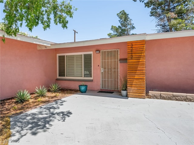 3212 Silver Saddle St, Las Vegas, NV 89169 - property entrance featuring stucco siding and a patio area