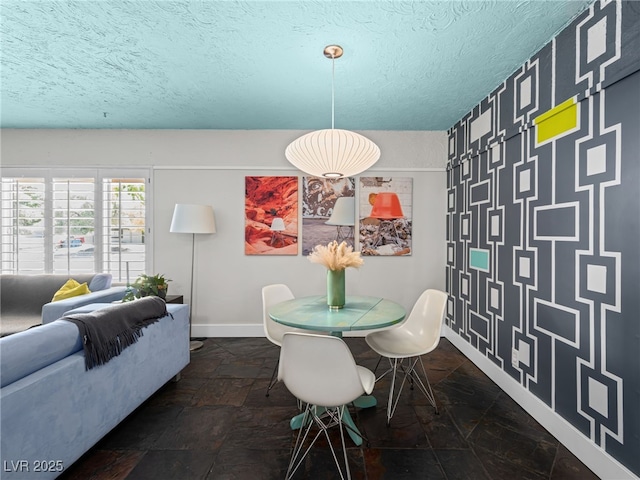 3212 Silver Saddle St, Las Vegas, NV 89169 - dining space with stone tile floors, a textured ceiling, and baseboards