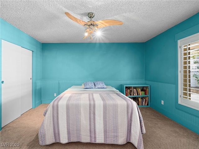 3212 Silver Saddle St, Las Vegas, NV 89169 - bedroom featuring carpet, wainscoting, ceiling fan, and a textured ceiling