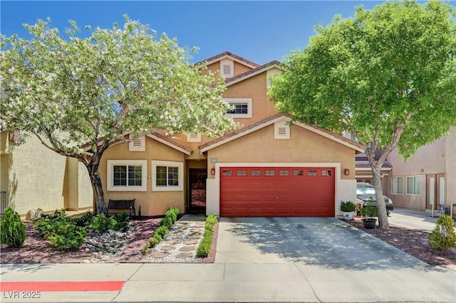9370 Corkfish St, Las Vegas, NV 89178 - view of front of house with stucco siding, driveway, and a garage