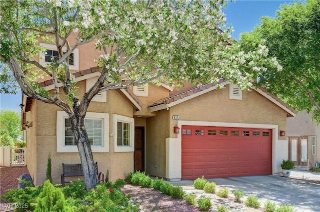 9370 Corkfish St, Las Vegas, NV 89178 - view of front of house featuring stucco siding, an attached garage, and concrete driveway