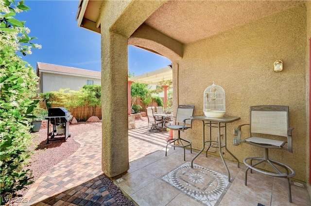 9370 Corkfish St, Las Vegas, NV 89178 - fenced backyard featuring a grill, a patio, and outdoor dining space