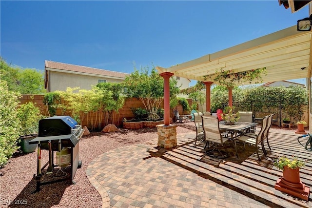 9370 Corkfish St, Las Vegas, NV 89178 - fenced backyard featuring area for grilling, a patio, and outdoor dining space