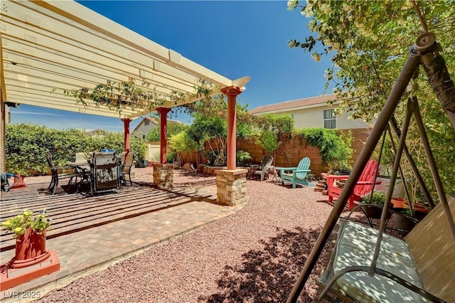 9370 Corkfish St, Las Vegas, NV 89178 - fenced backyard with a patio, outdoor dining area, and a pergola