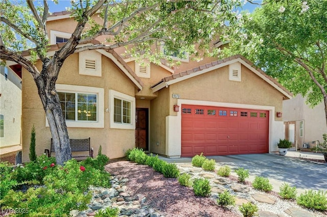 9370 Corkfish St, Las Vegas, NV 89178 - view of front of property with stucco siding, a garage, and driveway
