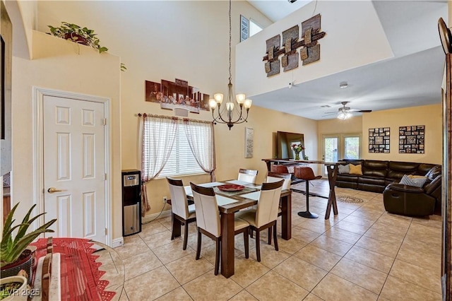 9370 Corkfish St, Las Vegas, NV 89178 - dining space featuring a chandelier, a towering ceiling, light tile patterned flooring, ceiling fan, and baseboards