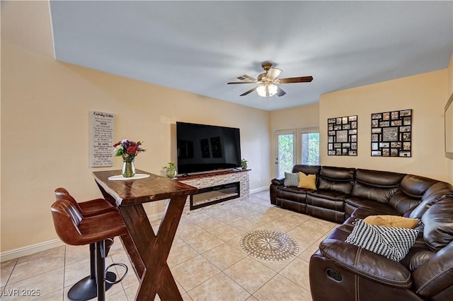 9370 Corkfish St, Las Vegas, NV 89178 - living room with ceiling fan, baseboards, and light tile patterned floors