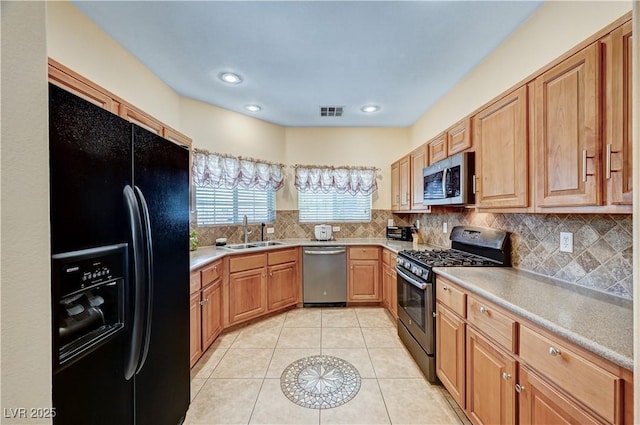 9370 Corkfish St, Las Vegas, NV 89178 - kitchen featuring stainless steel appliances, a sink, decorative backsplash, light countertops, and recessed lighting