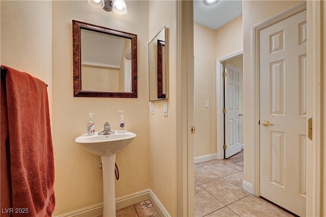 9370 Corkfish St, Las Vegas, NV 89178 - bathroom with tile patterned flooring, baseboards, and a sink