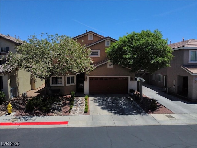 9370 Corkfish St, Las Vegas, NV 89178 - view of property hidden behind natural elements with stucco siding, a garage, and driveway