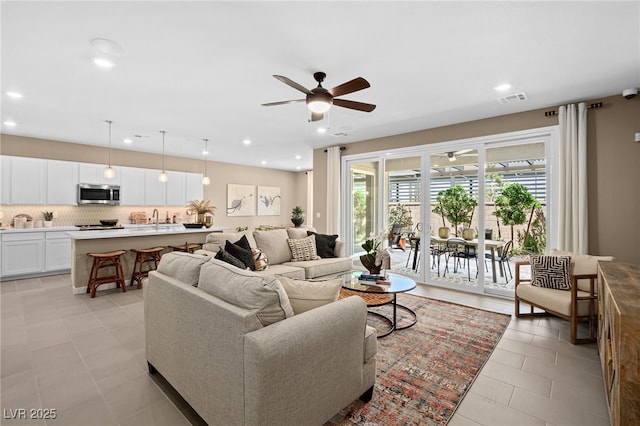 4360 E Brusca Way, Pahrump, NV 89061 - living area featuring ceiling fan, light tile patterned flooring, and recessed lighting
