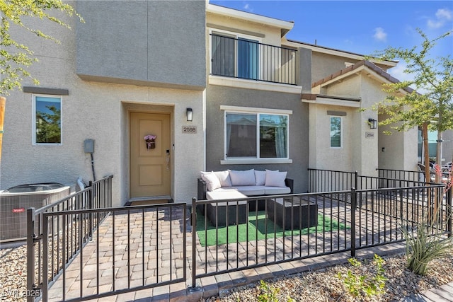 2598 Polar White Ave, North Las Vegas, NV 89086 - view of front of home with central AC, an outdoor hangout area, and stucco siding
