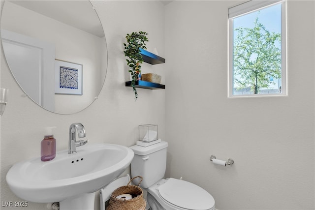 2598 Polar White Ave, North Las Vegas, NV 89086 - bathroom featuring a sink, plenty of natural light, and toilet