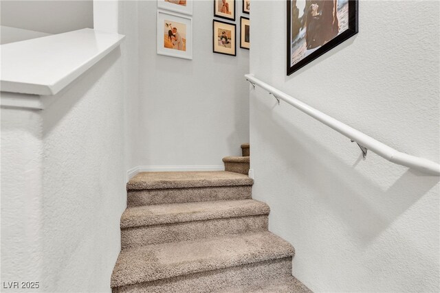 2598 Polar White Ave, North Las Vegas, NV 89086 - stairway featuring baseboards and a textured wall