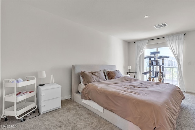 2598 Polar White Ave, North Las Vegas, NV 89086 - bedroom featuring light colored carpet, access to outside, and baseboards