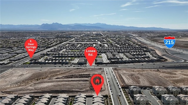 2598 Polar White Ave, North Las Vegas, NV 89086 - aerial view of residential area featuring a mountainous background