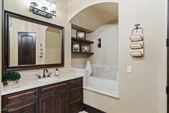 20 Via Paradiso St, Henderson, NV 89011 - bathroom featuring vanity, a garden tub, and backsplash