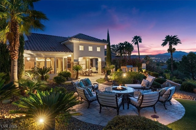20 Via Paradiso St, Henderson, NV 89011 - patio terrace at dusk with a patio and an outdoor fire pit