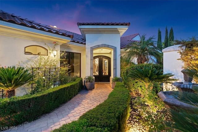 20 Via Paradiso St, Henderson, NV 89011 - doorway to property with french doors, a tile roof, and stucco siding
