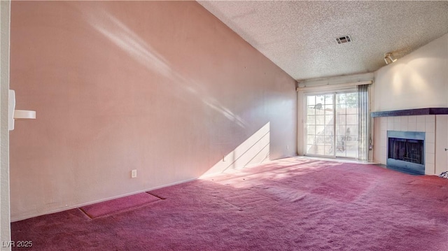 305 Crosswind Way, Las Vegas, NV 89145 - unfurnished living room with a textured ceiling, carpet, and a fireplace