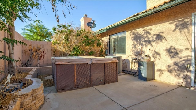 305 Crosswind Way, Las Vegas, NV 89145 - view of patio with a hot tub and central air condition unit