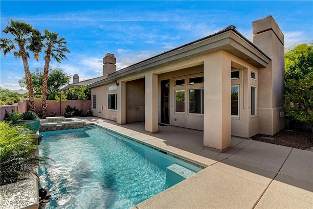 9921 Mirada Dr, Las Vegas, NV 89144 - rear view of house featuring a chimney, stucco siding, a patio area, and a pool with connected hot tub