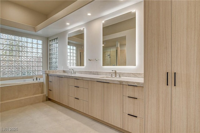 9921 Mirada Dr, Las Vegas, NV 89144 - full bath with double vanity, a bath, tile patterned flooring, and recessed lighting