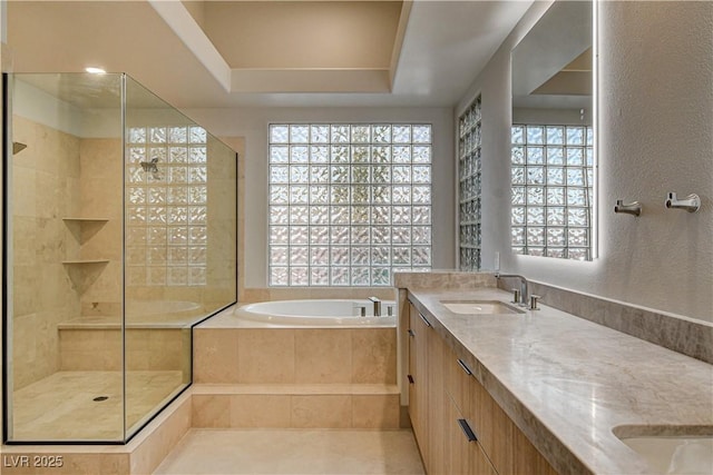 9921 Mirada Dr, Las Vegas, NV 89144 - bathroom with a garden tub, double vanity, and a shower stall
