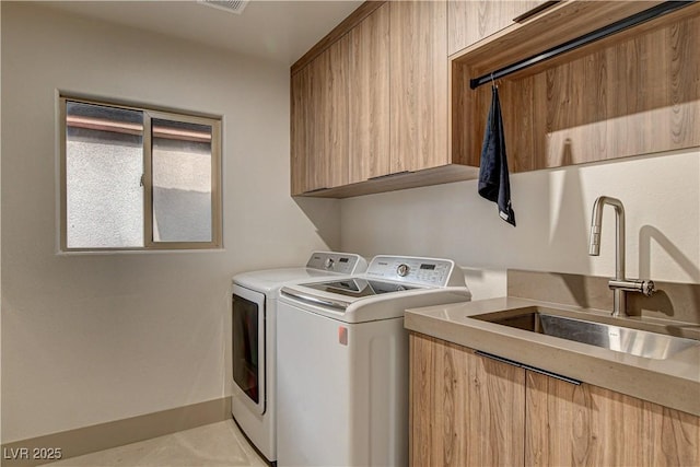 9921 Mirada Dr, Las Vegas, NV 89144 - laundry area featuring independent washer and dryer and cabinet space