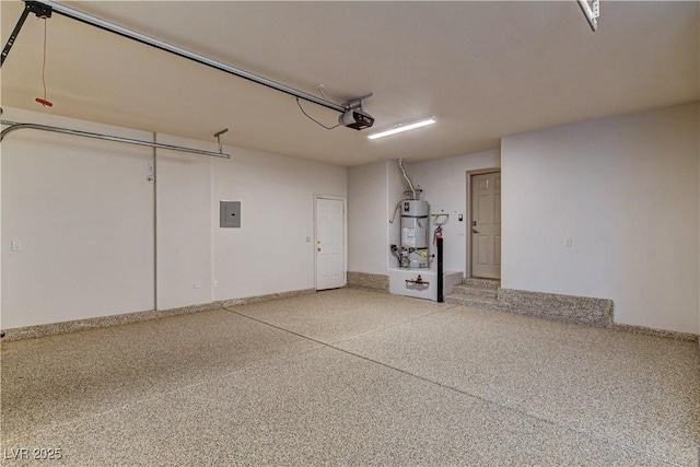 9921 Mirada Dr, Las Vegas, NV 89144 - garage featuring a garage door opener, electric panel, and strapped water heater