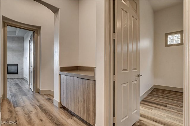 9921 Mirada Dr, Las Vegas, NV 89144 - hallway featuring light wood-style flooring and baseboards