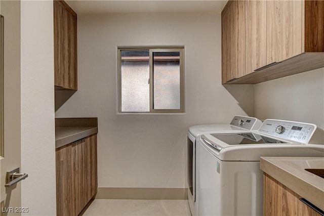 9921 Mirada Dr, Las Vegas, NV 89144 - laundry area with cabinet space, washing machine and clothes dryer, and baseboards