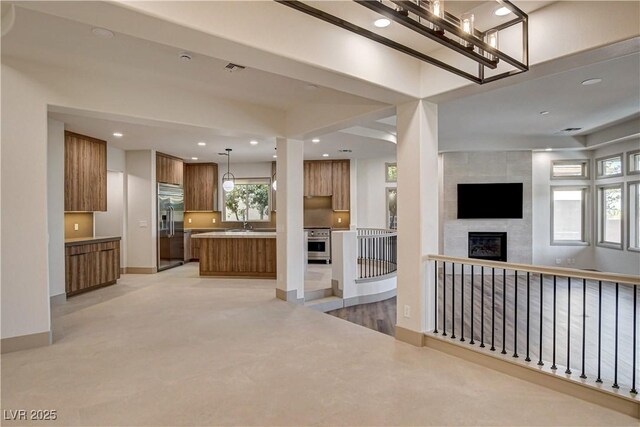 9921 Mirada Dr, Las Vegas, NV 89144 - unfurnished living room with a tile fireplace and recessed lighting
