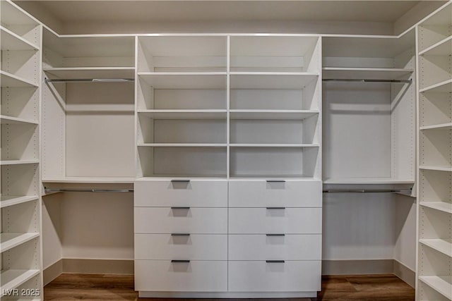 9921 Mirada Dr, Las Vegas, NV 89144 - walk in closet with dark wood finished floors