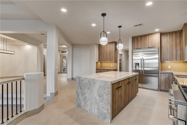 9921 Mirada Dr, Las Vegas, NV 89144 - kitchen with premium appliances, modern cabinets, a center island, and recessed lighting