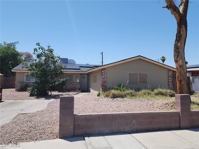 109 Prince Ln, Las Vegas, NV 89110 - view of front facade featuring solar panels and brick siding