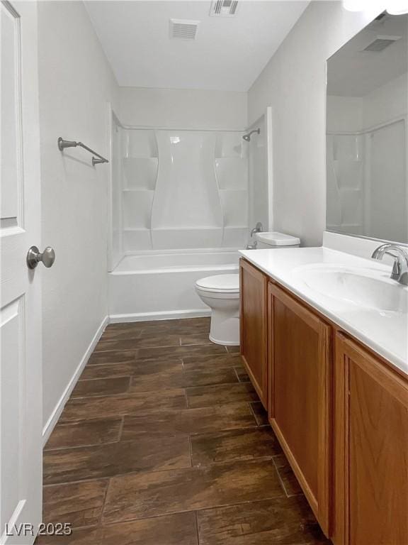 7873 Running Doe Ct, Las Vegas, NV 89149 - bathroom featuring wood finished floors, toilet, vanity, and tub / shower combination