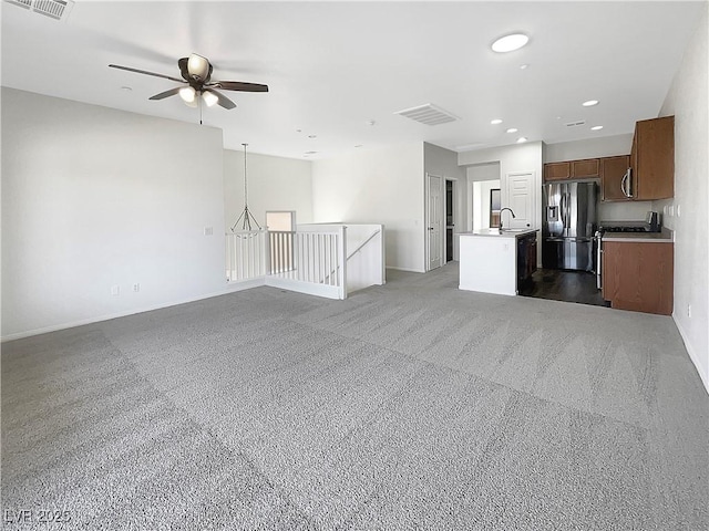 7873 Running Doe Ct, Las Vegas, NV 89149 - unfurnished living room featuring baseboards, ceiling fan, recessed lighting, and a sink
