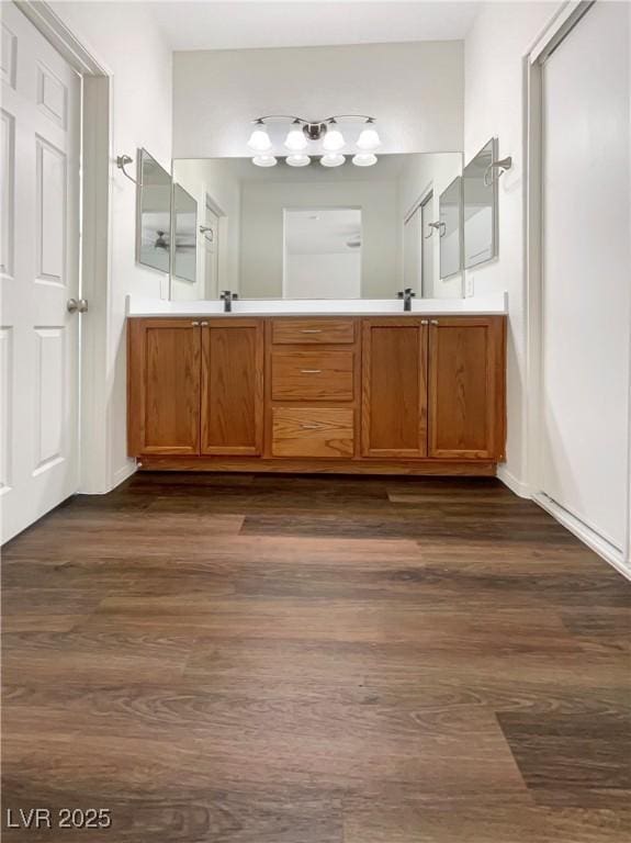 7873 Running Doe Ct, Las Vegas, NV 89149 - bathroom featuring wood finished floors and double vanity