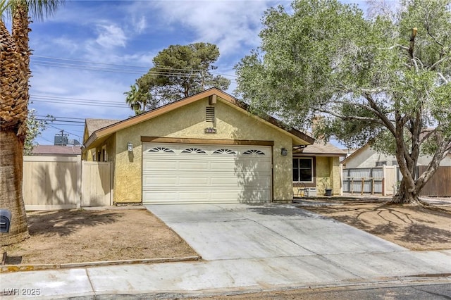 1012 Winwood St, Las Vegas, NV 89108 - ranch-style home featuring stucco siding, a garage, and concrete driveway