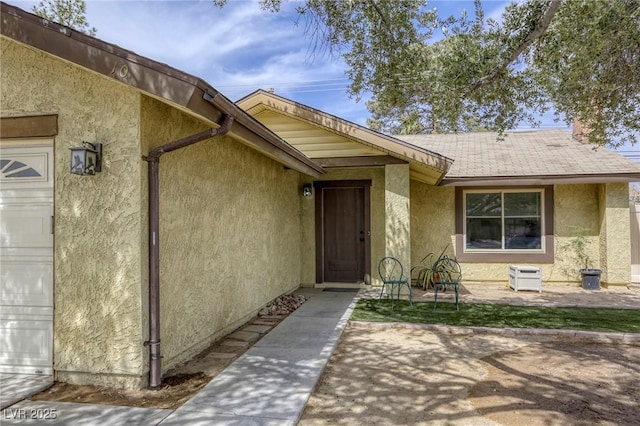1012 Winwood St, Las Vegas, NV 89108 - doorway to property with stucco siding and a garage